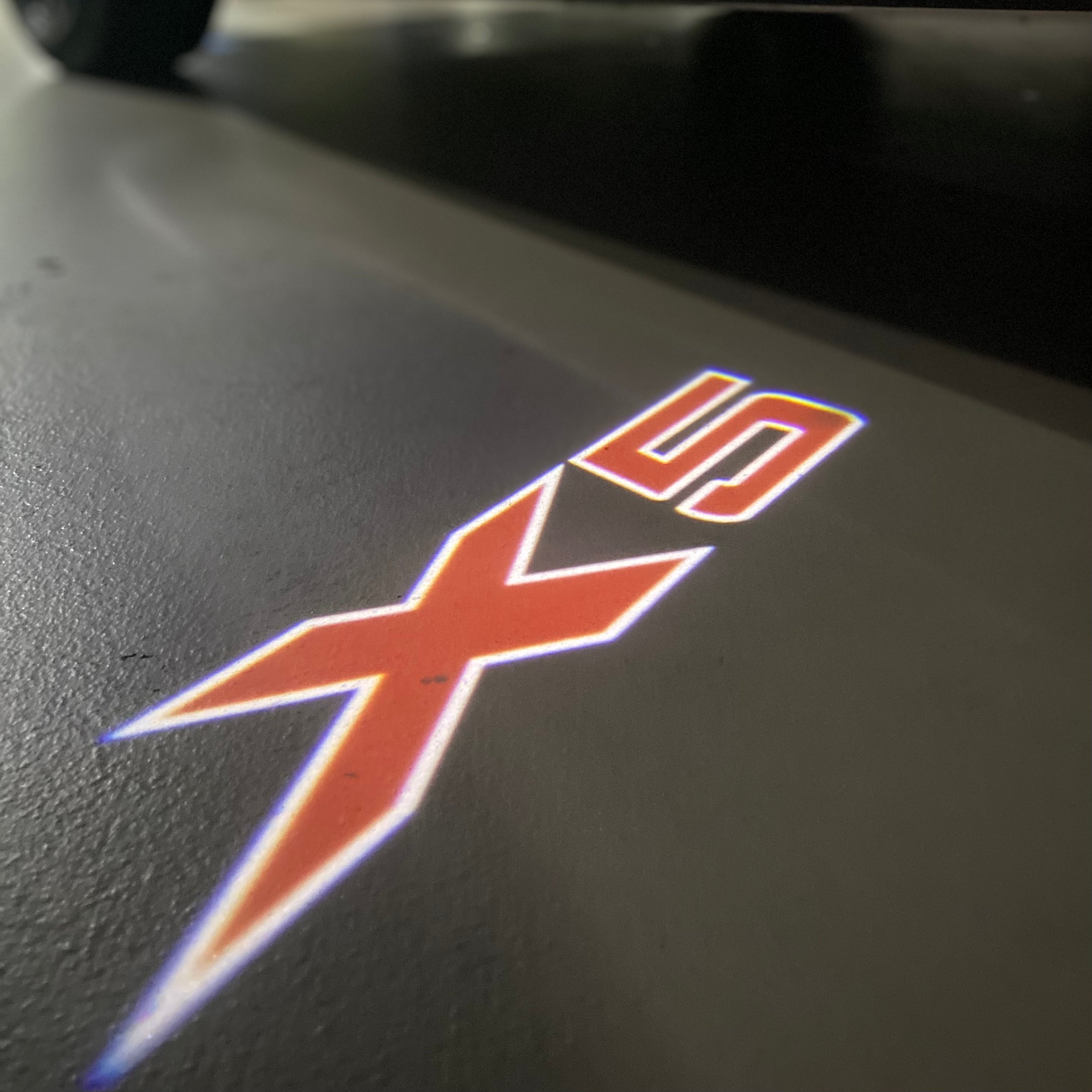 BMW X5   LOGO PROJECTOT LIGHTS (quantity 1 = 1 sets/2 door lights) Nr.6024q0t048