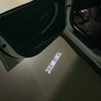 BMW X5M LOGO PROJECTOT LIGHTS (quantity 1 = 1 sets/2 door lights) Nr.6024q0t071