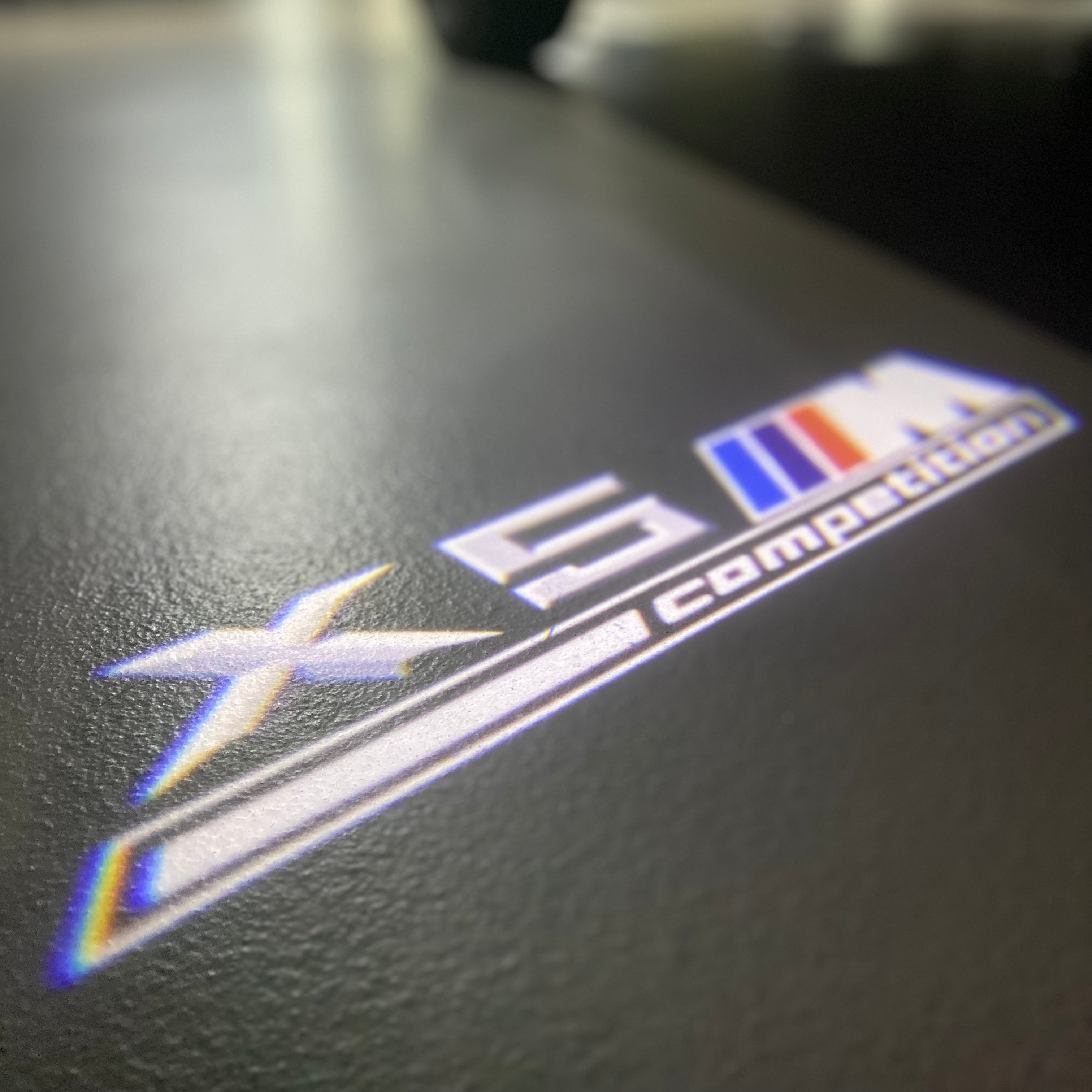 BMW X5M  LOGO PROJECTOT LIGHTS (quantity 1 = 1 sets/2 door lights) Nr.6024q0t049