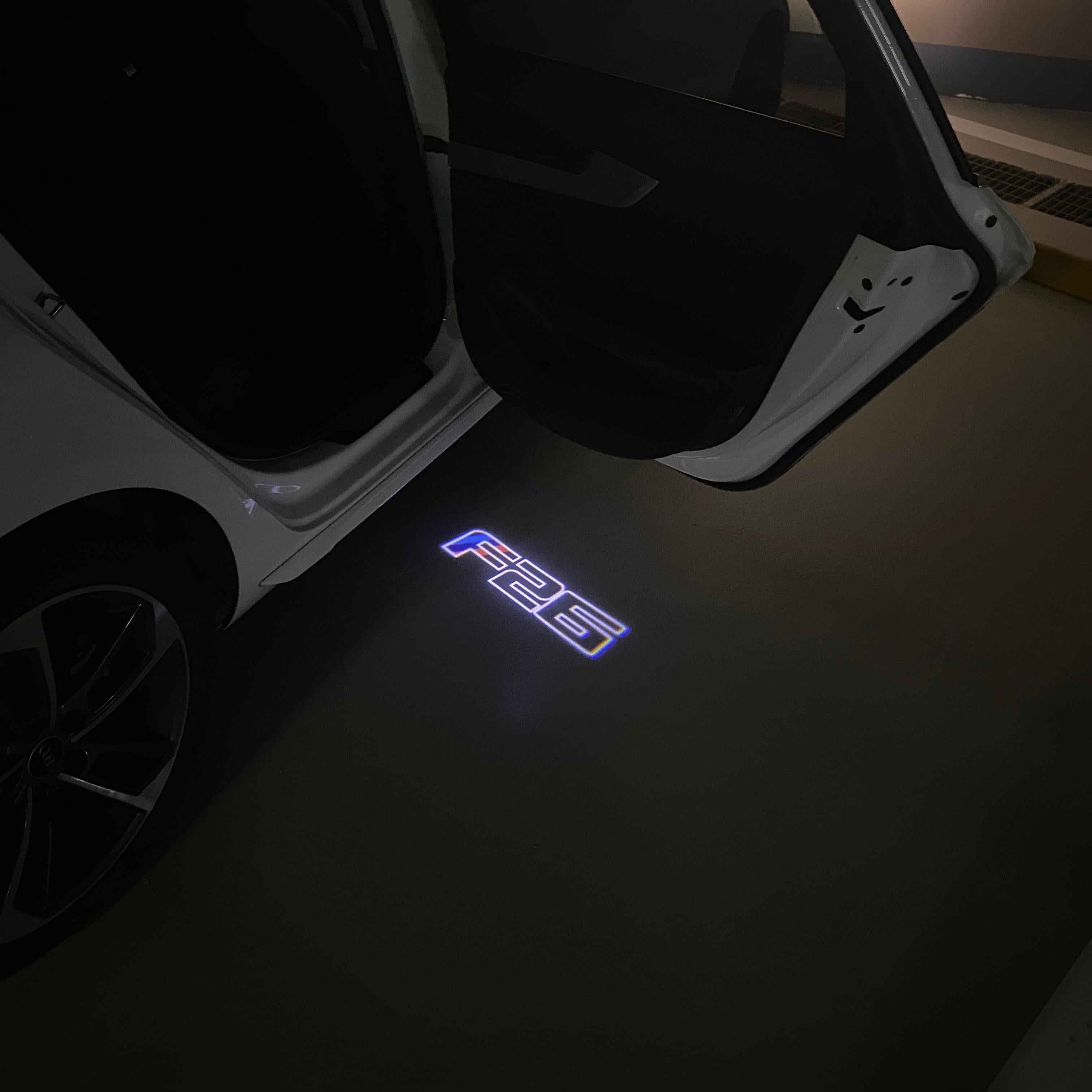 BMW X4 / X4M F26  LOGO PROJECTOT LIGHTS (quantity 1 = 1 sets/2 door lights) Nr.6024q0t04B7