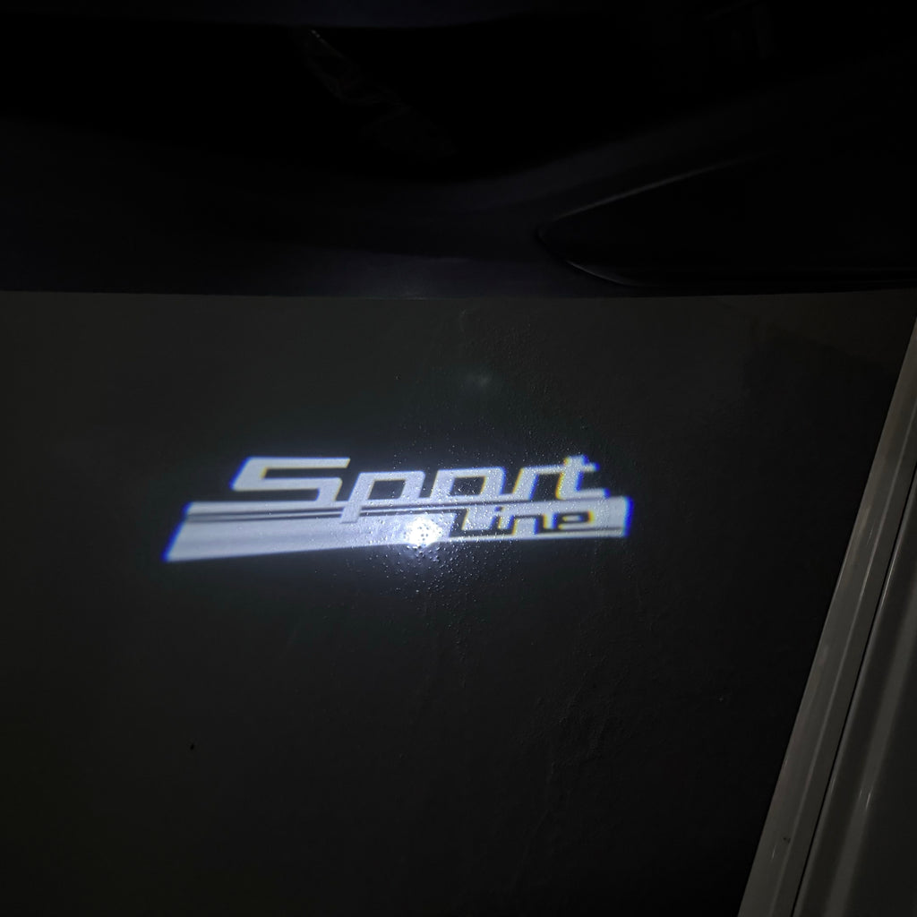 BMW Sportline    LOGO PROJECTOT LIGHTS (quantity 1 = 1 sets/2 door lights) Nr.6024q123