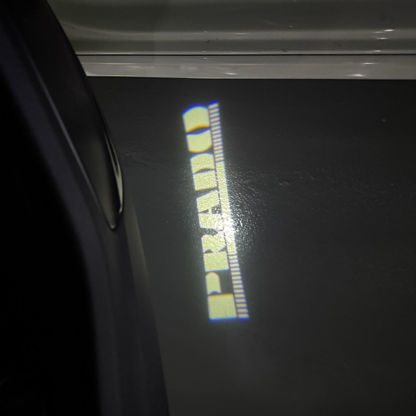 TOYOTA  PRADO LOGO PROJECROTR LIGHTS  (quantity 1 = 1 sets/2 door lights) Nr.0G15