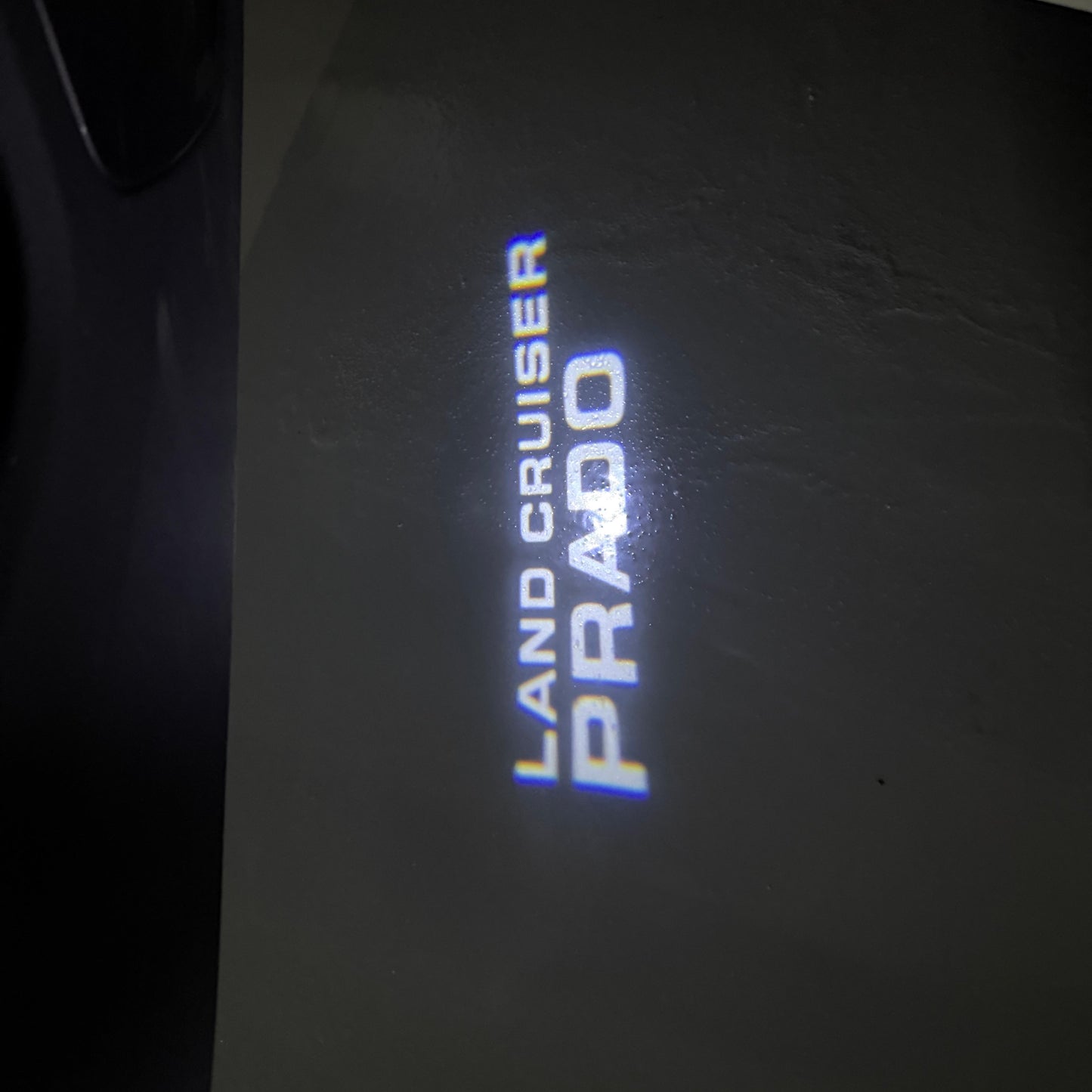 TOYOTA  PRADO LOGO PROJECROTR LIGHTS  (quantity 1 = 1 sets/2 door lights) Nr.0G13