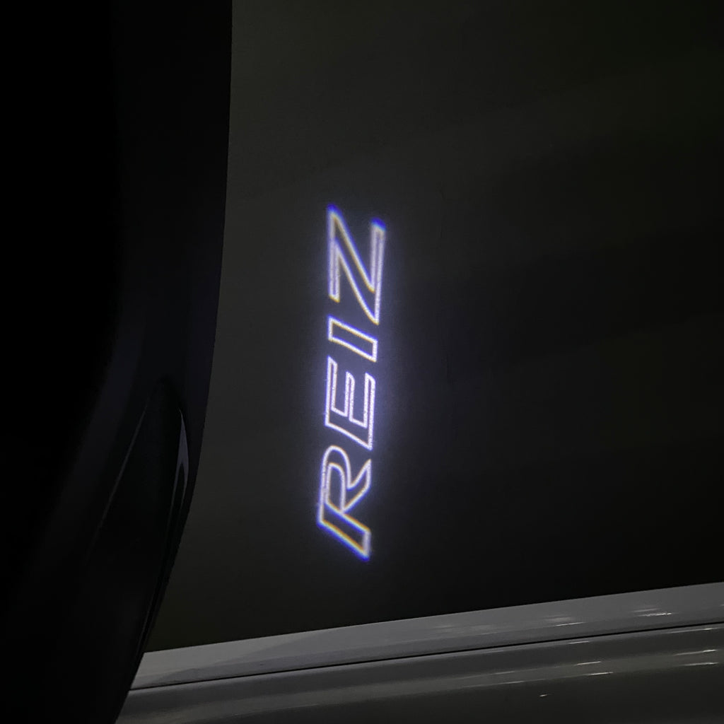 TOYOTA  REIZ LOGO PROJECROTR LIGHTS  (quantity 1 = 1 sets/2 door lights) Nr.0G09