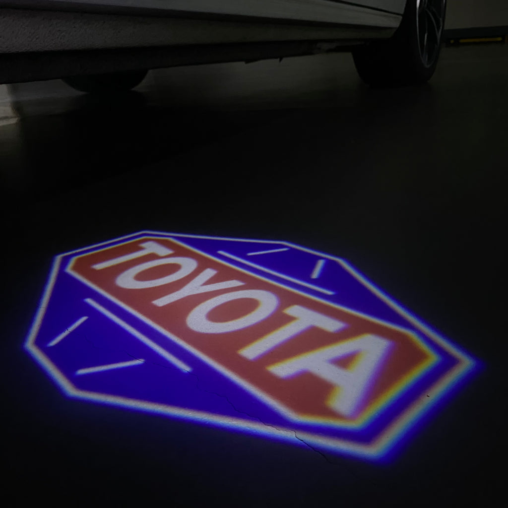 TOYOTA  ORIGINAL LOGO PROJECROTR LIGHTS  (quantity 1 = 1 sets/2 door lights) Nr.0G45