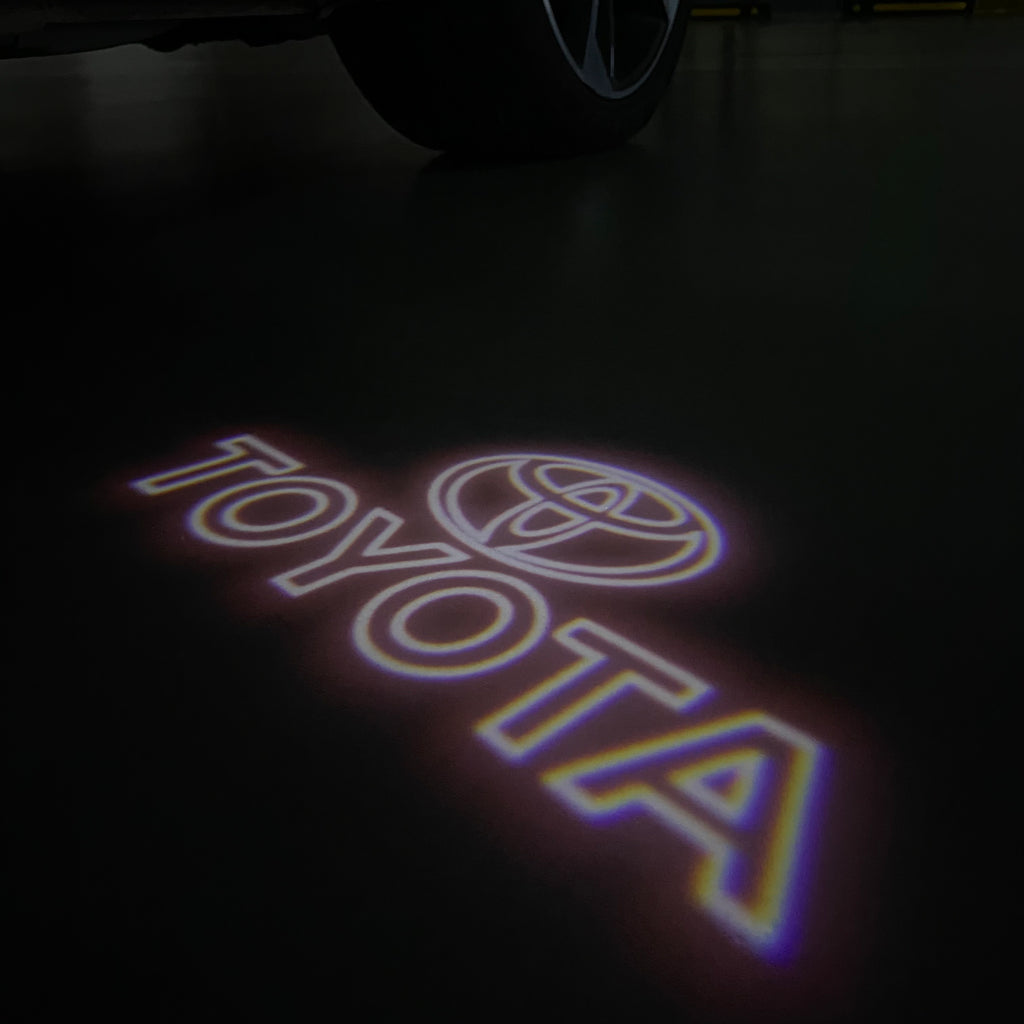 TOYOTA  ORIGINAL LOGO PROJECROTR LIGHTS  (quantity 1 = 1 sets/2 door lights) Nr.0G44