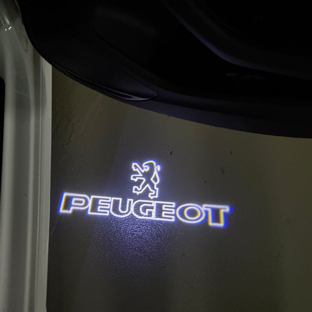 PEUGEOT ORIGINAL  LOGO PROJECTOT LIGHTS (quantity 1 = 1 sets/2 door lights) Nr.6024q69