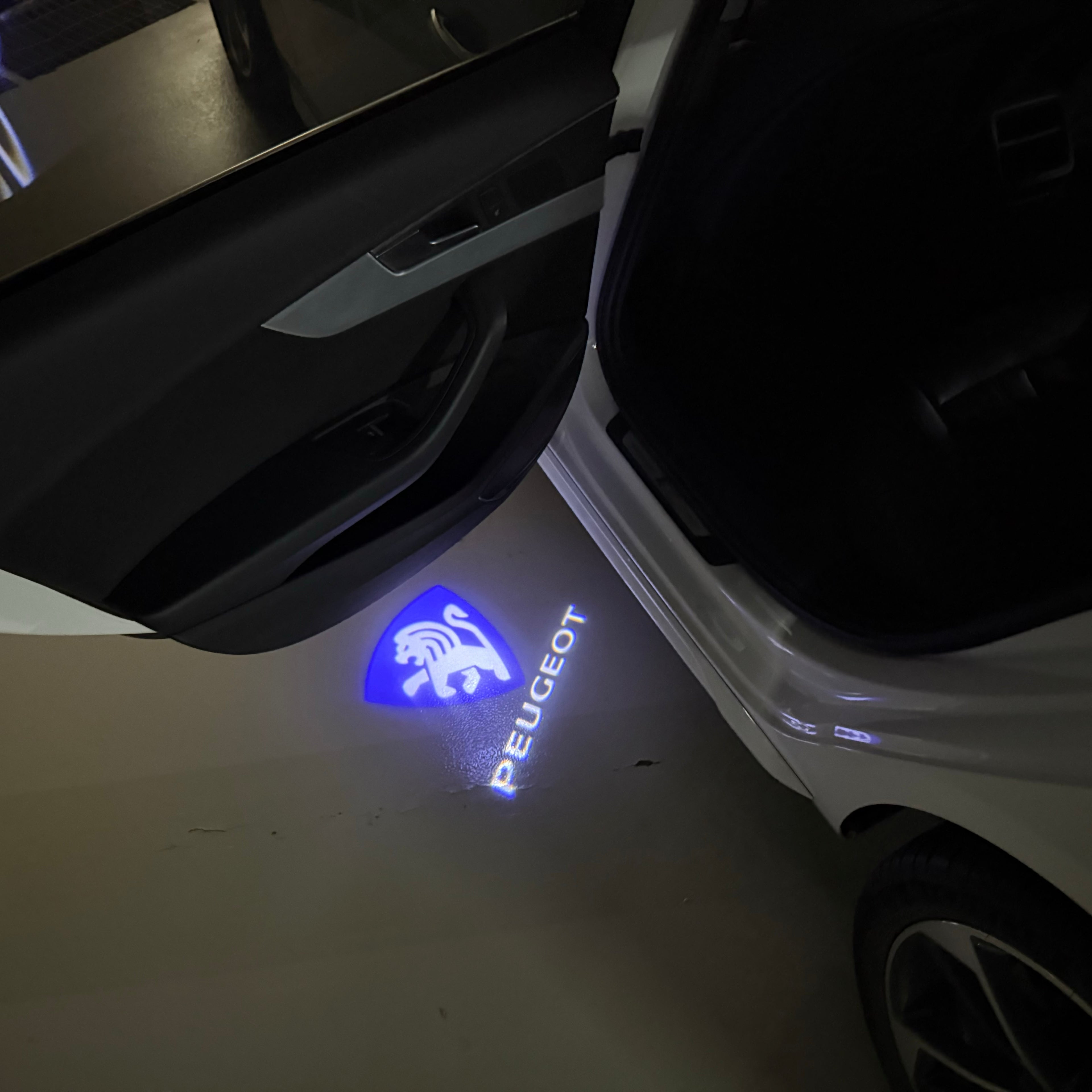 PEUGEOT ORIGINAL  LOGO PROJECTOT LIGHTS (quantity 1 = 1 sets/2 door lights) Nr.6024q70