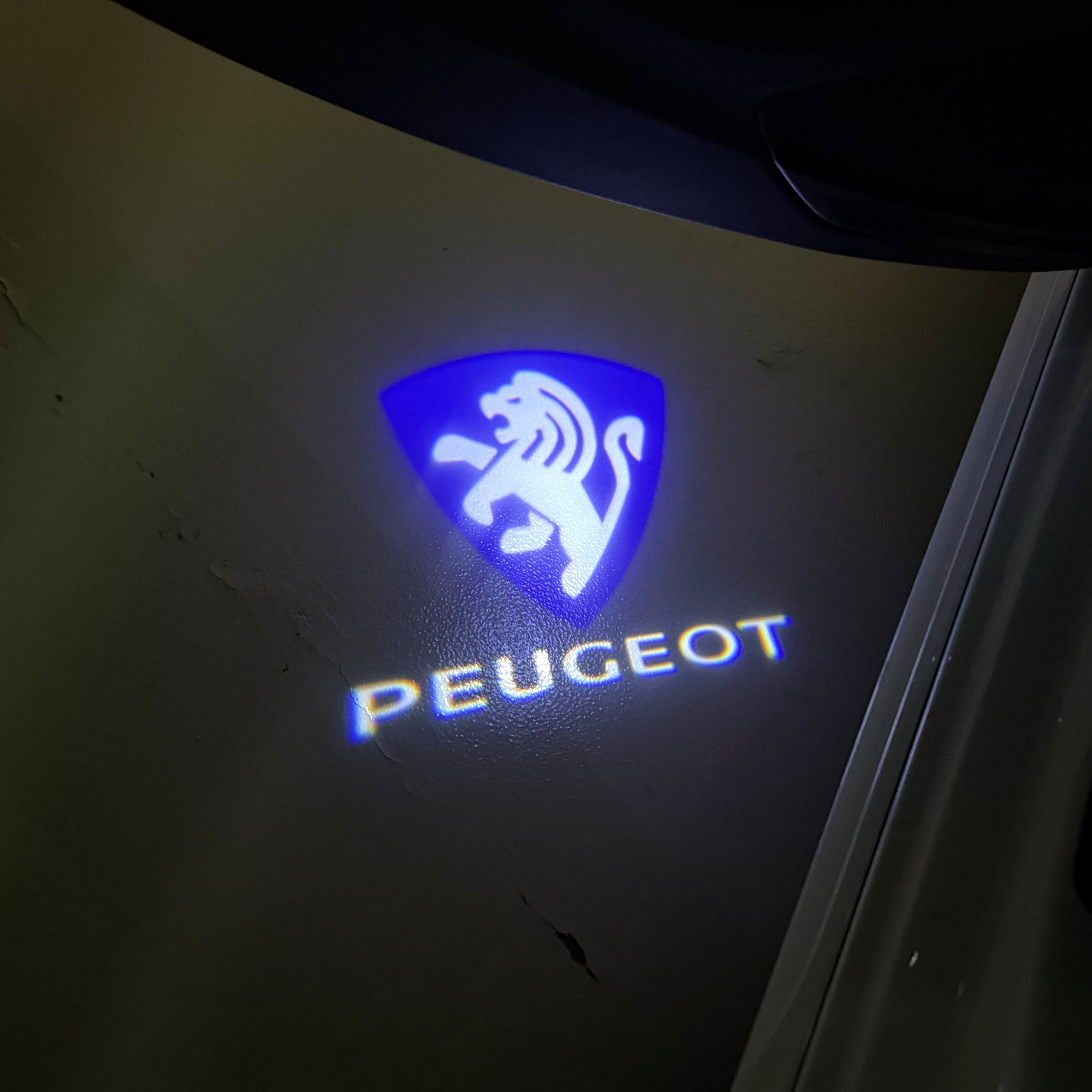PEUGEOT ORIGINAL  LOGO PROJECTOT LIGHTS (quantity 1 = 1 sets/2 door lights) Nr.6024q70