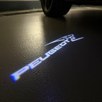 PEUGEOT ORIGINAL  LOGO PROJECTOT LIGHTS (quantity 1 = 1 sets/2 door lights) Nr.6024q64