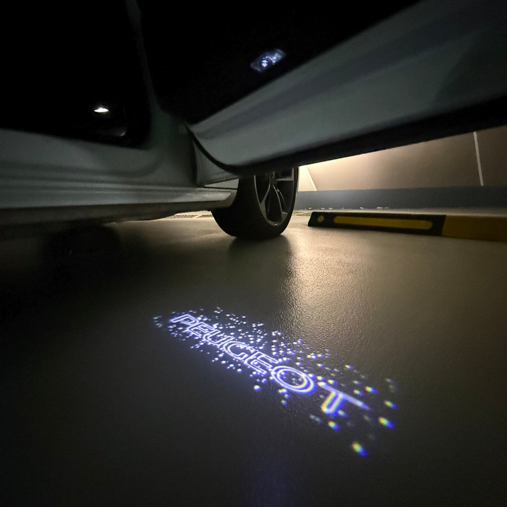 PEUGEOT ORIGINAL  LOGO PROJECTOT LIGHTS (quantity 1 = 1 sets/2 door lights) Nr.6024q72