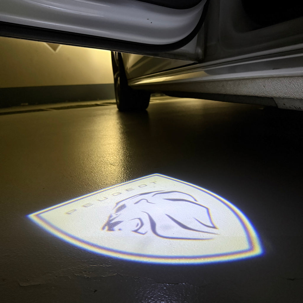 PEUGEOT ORIGINAL  LOGO PROJECTOT LIGHTS (quantity 1 = 1 sets/2 door lights) Nr.6024q73
