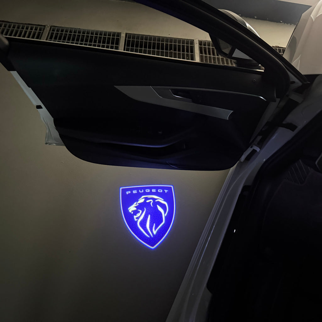 PEUGEOT ORIGINAL  LOGO PROJECTOT LIGHTS (quantity 1 = 1 sets/2 door lights) Nr.6024q74
