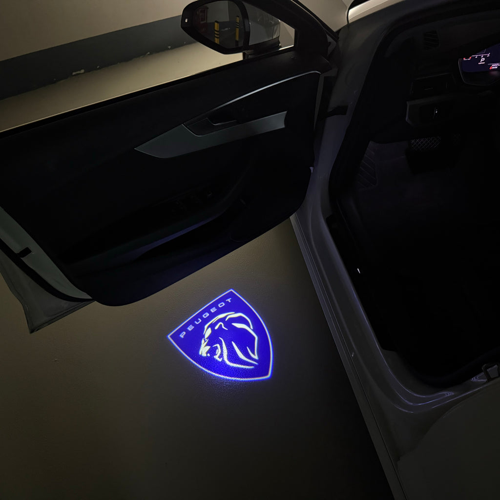 PEUGEOT ORIGINAL  LOGO PROJECTOT LIGHTS (quantity 1 = 1 sets/2 door lights) Nr.6024q74