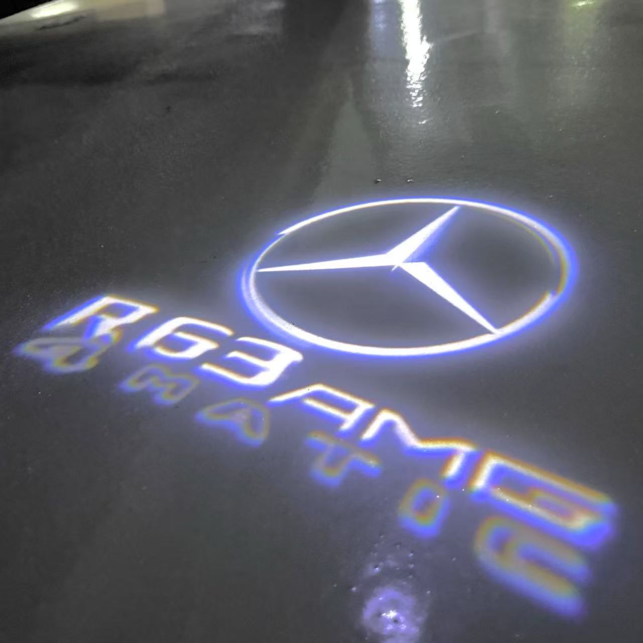 MERCEDES BENZ R 63 AMG LOGO PROJECTOR LIGHTS  (quantity 1 = 1 sets/2 door lights)Nr.03f044