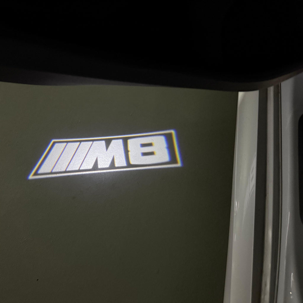 BMW 8 SERIES M8   LOGO PROJECTOT LIGHTS (quantity 1 = 1 sets/2 door lights) Nr.6024q107