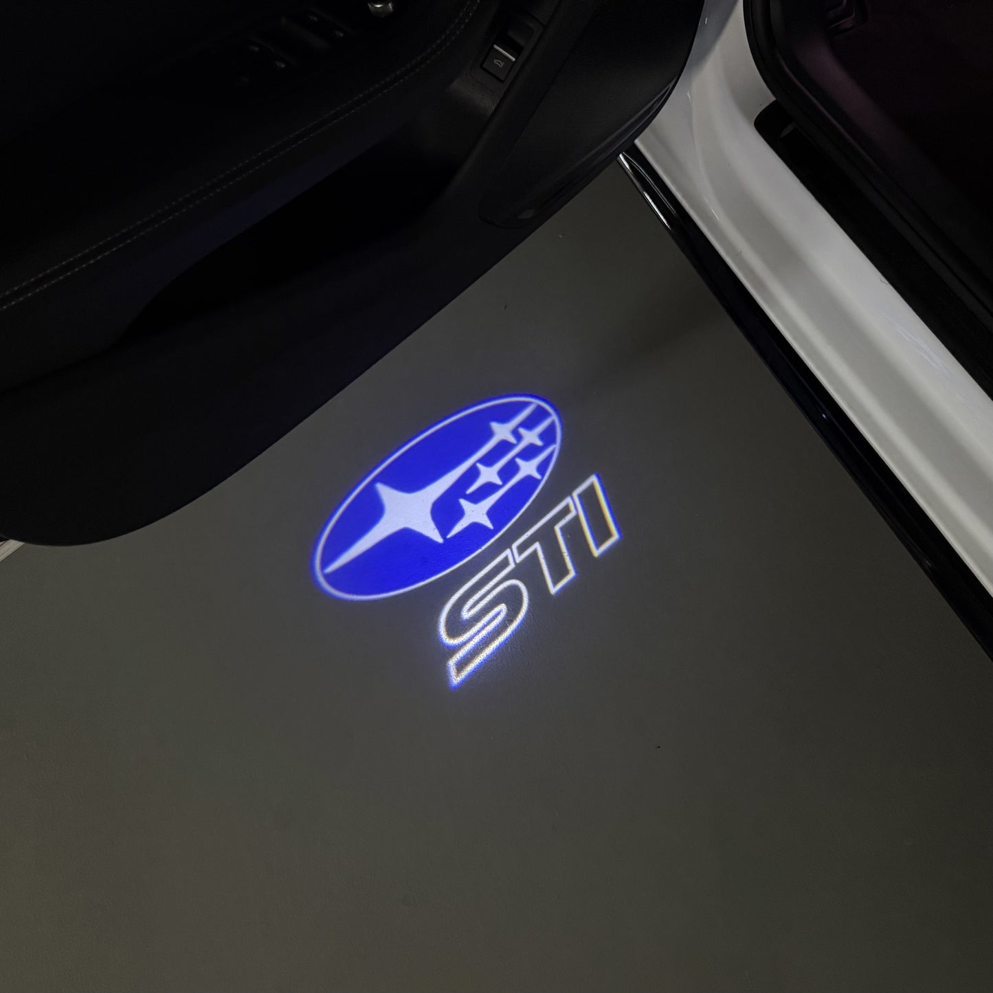 SUBARU IMPREZA STI LOGO PROJECROTR LIGHTS (quantity 1 = 1 sets/2 door lights) Nr.03A24