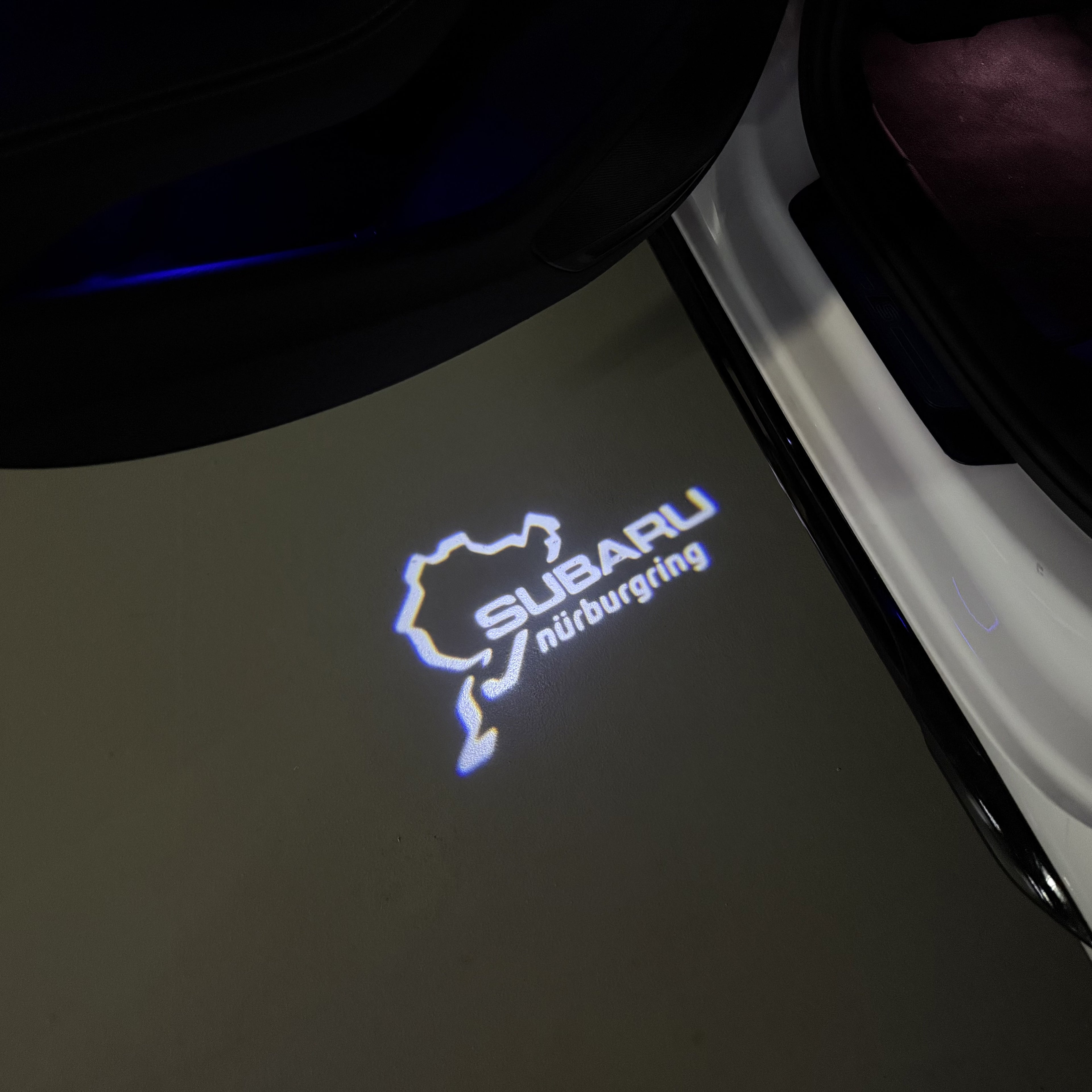 SUBARU ORIGINAL LOGO PROJECROTR LIGHTS (quantity 1 = 1 sets/2 door lights) Nr.03A5