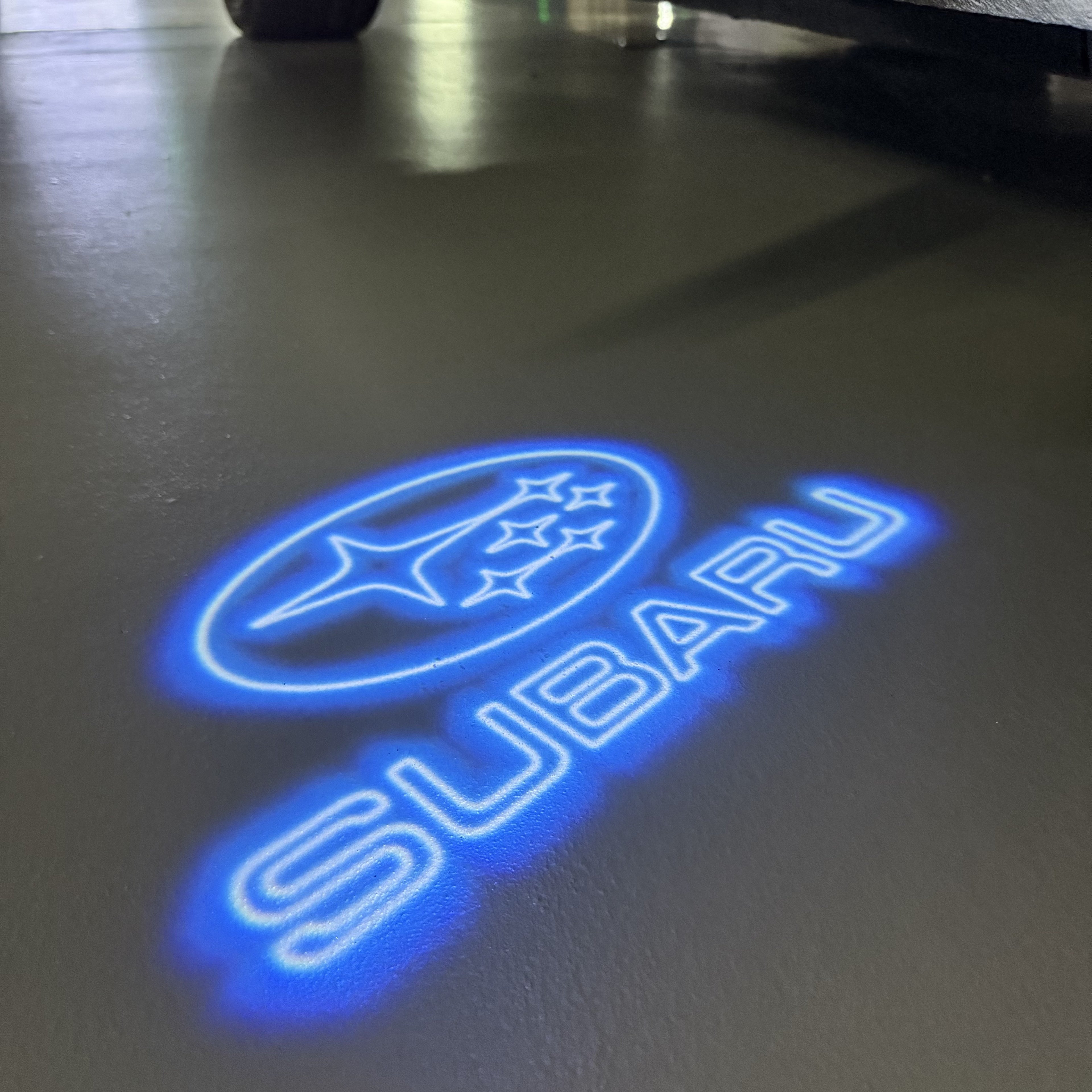 SUBARU ORIGINAL LOGO PROJECROTR LIGHTS (quantity 1 = 1 sets/2 door lights) Nr.9