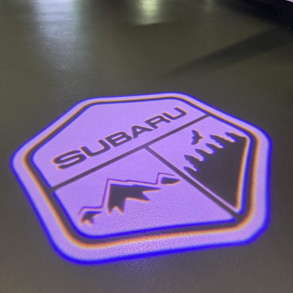 SUBARU ORIGINAL LOGO PROJECROTR LIGHTS (quantity 1 = 1 sets/2 door lights) Nr.8