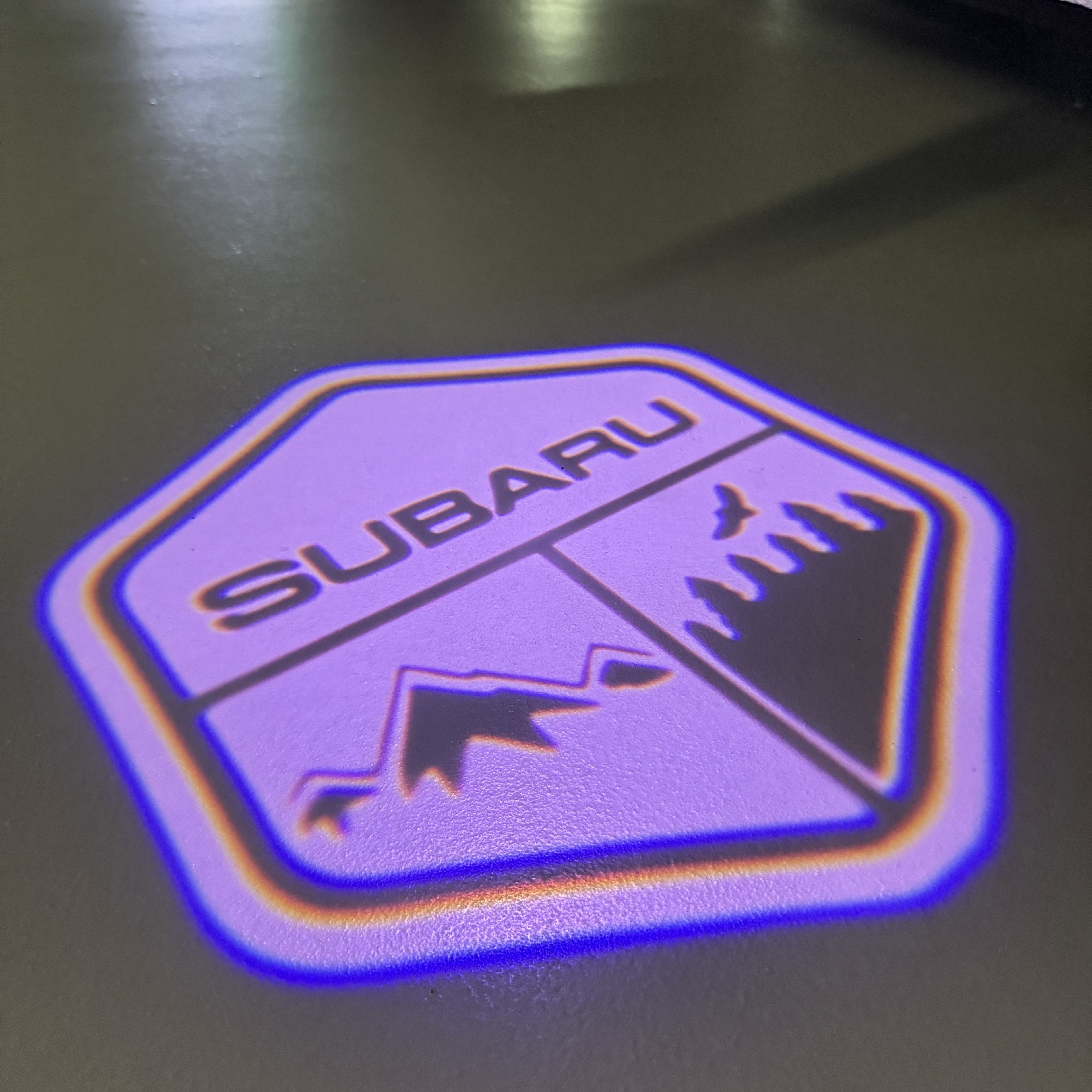 SUBARU ORIGINAL LOGO PROJECROTR LIGHTS (quantity 1 = 1 sets/2 door lights) Nr.8