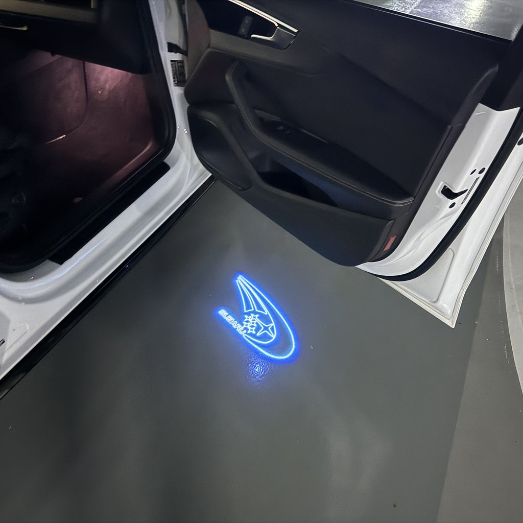 SUBARU ORIGINAL LOGO PROJECROTR LIGHTS (quantity 1 = 1 sets/2 door lights) Nr.11