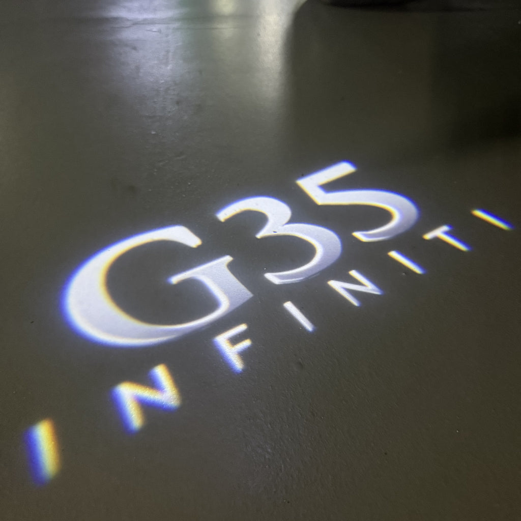 INFINITI  G35  LOGO PROJECROTR LIGHTS  (quantity 1 = 1 sets/2 door lights)Nr.74A56