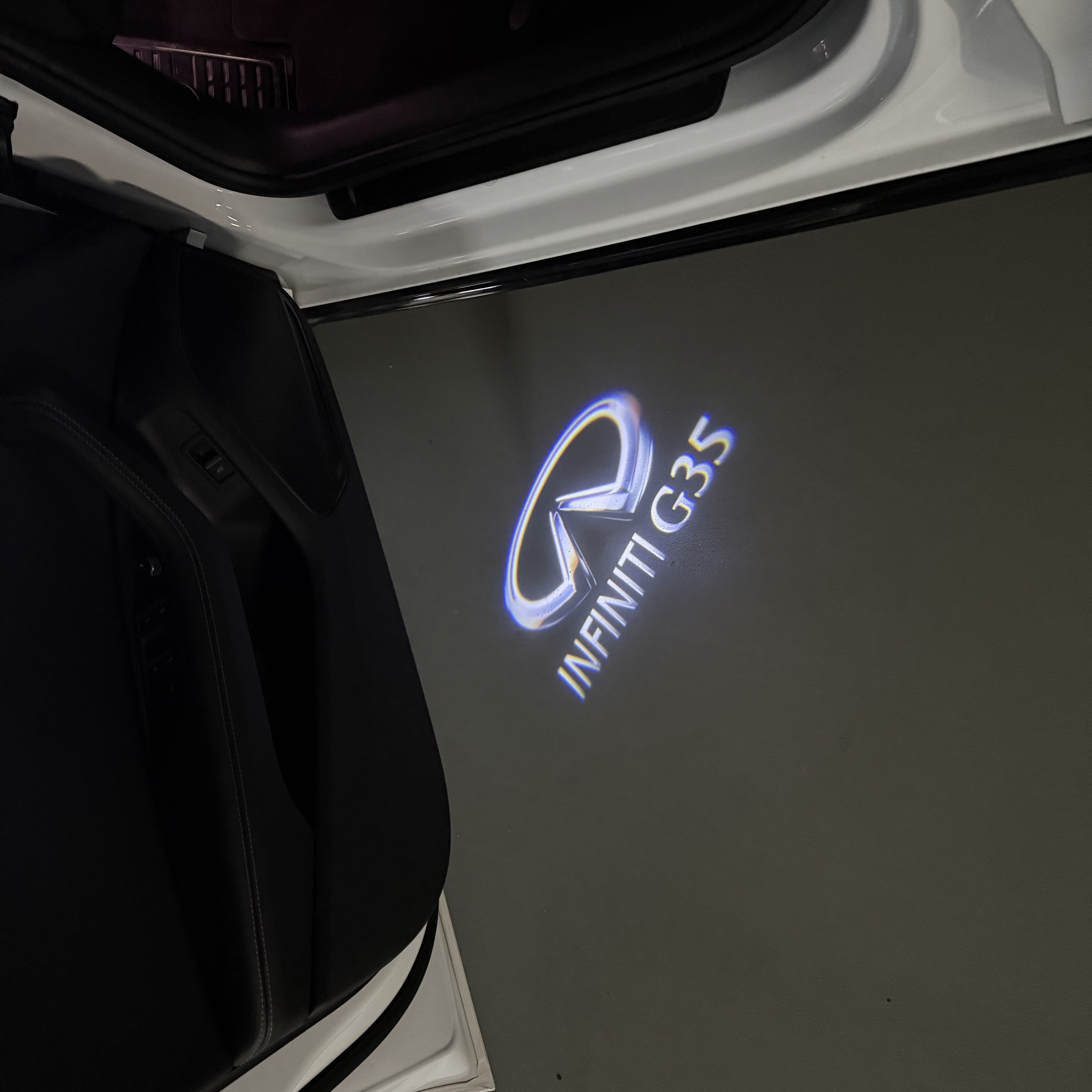INFINITI  G35 LOGO PROJECROTR LIGHTS  (quantity 1 = 1 sets/2 door lights)Nr.74A60