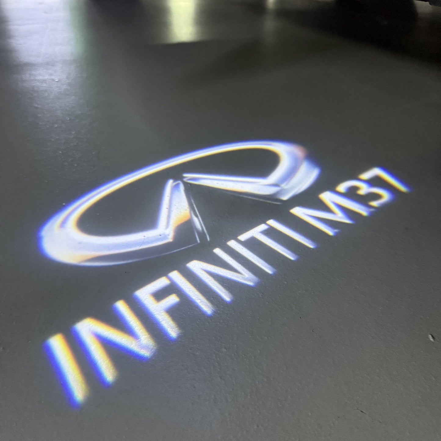 INFINITI  M37 LOGO PROJECROTR LIGHTS  (quantity 1 = 1 sets/2 door lights)Nr.74A90