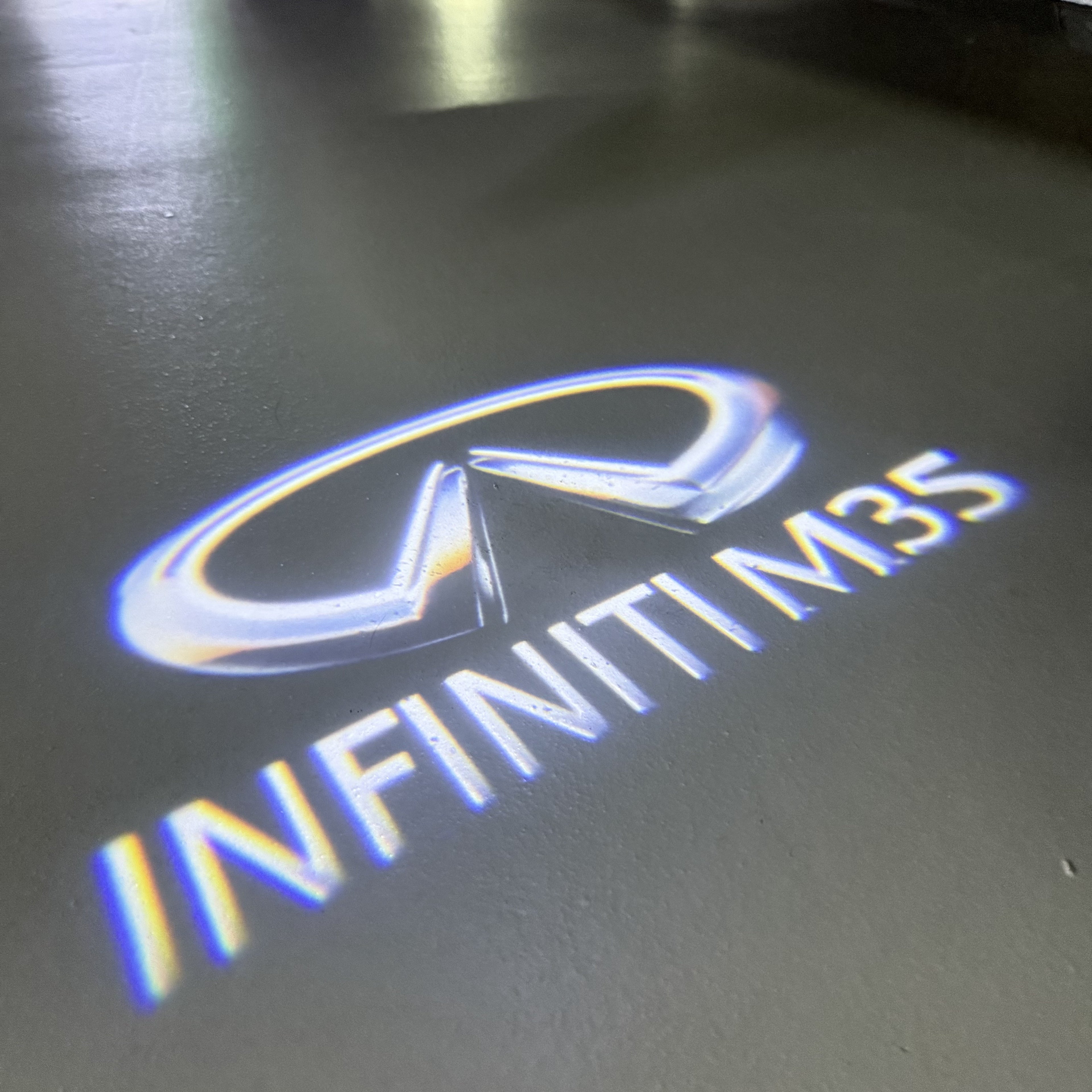 INFINITI  M35 LOGO PROJECROTR LIGHTS  (quantity 1 = 1 sets/2 door lights)Nr.74A91