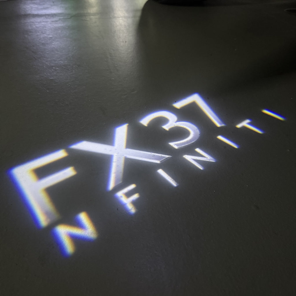INFINITI  FX37 LOGO PROJECROTR LIGHTS  (quantity 1 = 1 sets/2 door lights)Nr.74A72