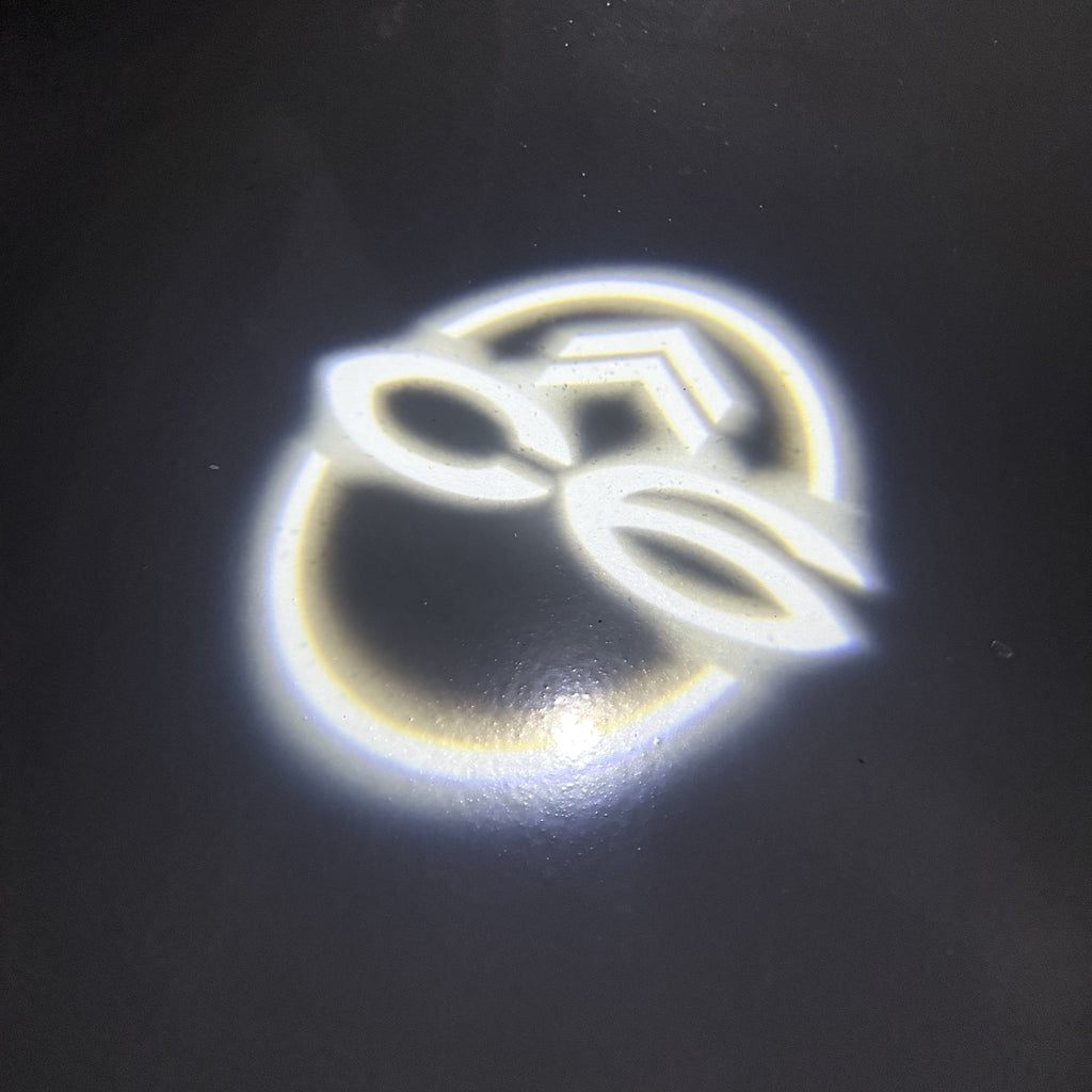 CITROËN C6  LOGO PROJECTOT LIGHTS (quantity 1 = 1 sets/2 door lights) Nr.6024q0t0138