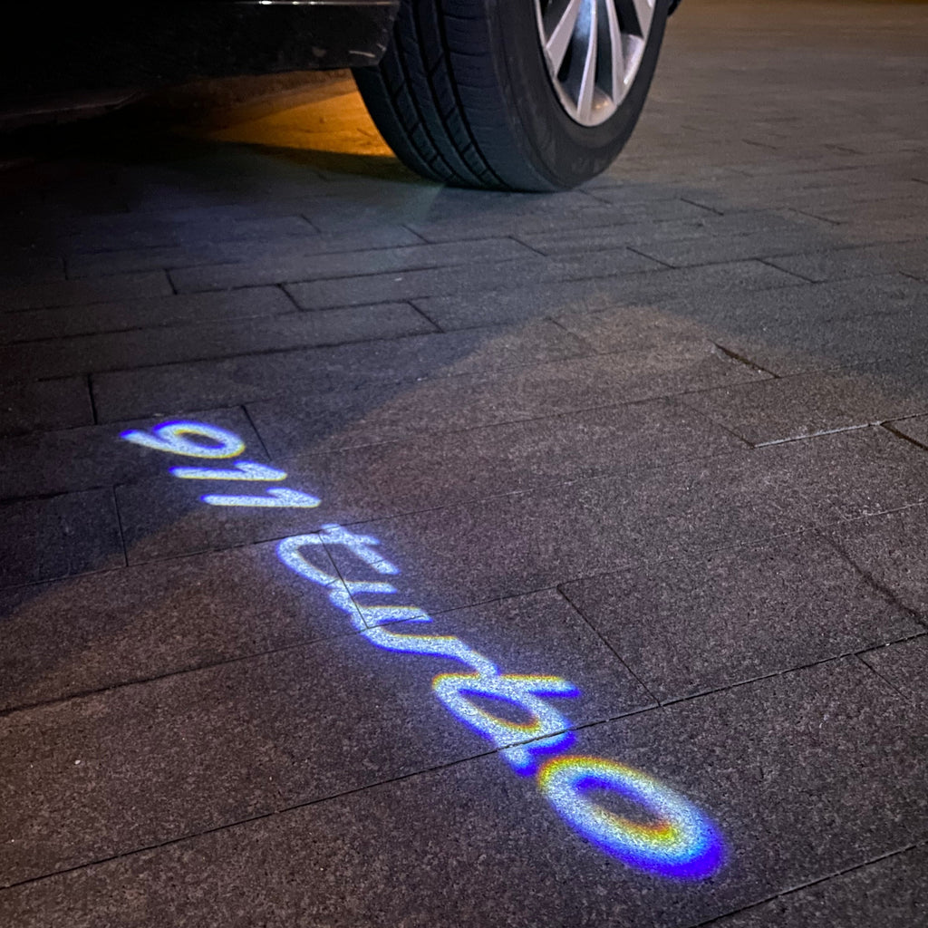 PORSCHE 911 LOGO PROJECTOT LIGHTS Nr.49 (quantity  1 =  2 Logo Film /  2 door lights)