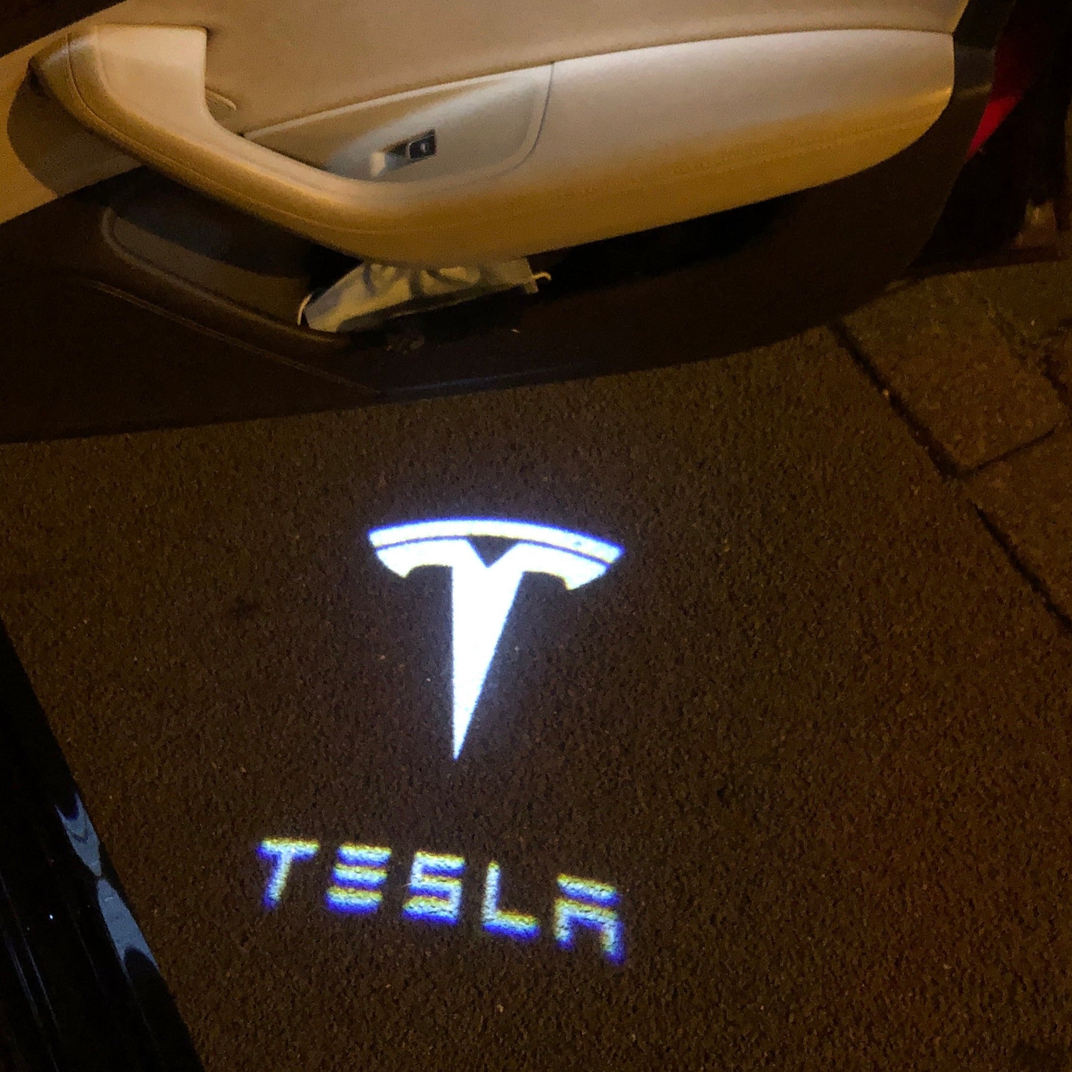 TESLA LOGO PROJECROTR LIGHTS Nr.1501 (quantity  1 =  2 Logo Film /  2 door lights)
